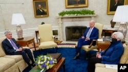 President Joe Biden meets with Treasury Secretary Janet Yellen, right, and Federal Reserve Chairman Jerome Powell in the Oval Office of the White House, in Washington, May 31, 2022.