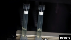 FILE: Two samples of suspected cases of monkeypox go through a process of nucleic acid extraction as they get tested at a microbiology lab at La Paz Hospital in Madrid, Spain, June 1, 2022. 