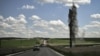 A mortar explodes next to the road leading to the city of Lysychansk in the eastern Ukranian region of Donbas, May 23, 2022, amid Russian invasion of Ukraine. 
