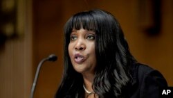 FILE - Lisa Cook speaks during a confirmation hearing, Feb. 3, 2022, in Washington. The Senate confirmed Cook to the Federal Reserve's board of governors on Tuesday, making her the first Black woman on the board in the institution's 108-year history. 
