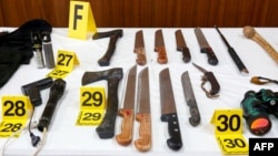 FILE - Bladed weapons seized as a result of the dismantling of an Islamic State group-affiliated cell that was planning suicide bombings in Morocco are shown during a Sept. 11, 2020, press conference by the director of Morocco's Central Bureau of Judicial Investigation.