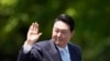 FILE -South Korea's new President Yoon Suk Yeol waves from a car after the Presidential Inauguration outside the National Assembly in Seoul, South Korea, May 10, 2022. This week, he will represent South Korea at the NATO summit in Madrid.