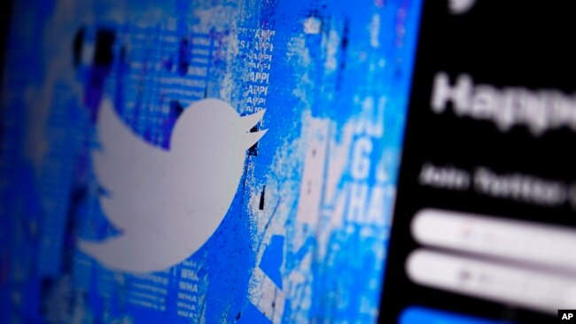 FILE - The Twitter splash page is seen on a digital device, Monday, April 25, 2022, in San Diego. Elon Musk said Friday that his $44-billion deal to buy Twitter was “temporarily on hold.” (AP Photo/Gregory Bull/File)
