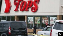 Several people were shot, May 14, 2022, at a supermarket in Buffalo, N.Y. Police said they have a suspect in custody.