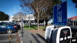 FILE - Electric vehicle charging stations is seen at a carpark in Auckland, New Zealand, on July 1, 2021. (Jason Oxenham/New Zealand Herald via AP)
