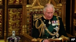 Prince Charles reads the Queen's speech next to her crown during the State Opening of Parliament, at the Palace of Westminster in London, May 10, 2022. Queen Elizabeth II did not attend the opening of Parliament amid ongoing mobility issues. 