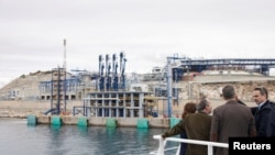 FILE - Greek Prime Minister Kyriakos Mitsotakis visits the facilities of DESFA liquefied natural gas (LNG) terminal, on the islet of Revithoussa, Greece, April 19, 2022. (Dimitris Papamitsos/Greek Prime Minister's Office/Handout via Reuters) 