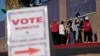 FILE - People wait in line to vote at a polling station on election day in Las Vegas, Nevada, Nov. 3, 2020.