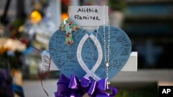 Alithia Ramirez's cross stands at a memorial site for the victims killed in this week's shooting at Robb Elementary School in Uvalde, Texas, May 27, 2022.