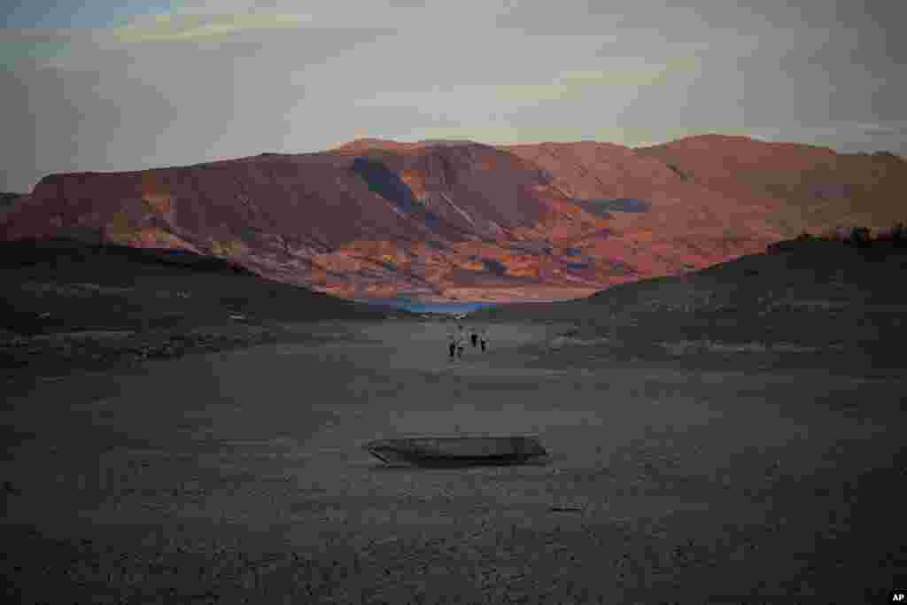 A sunken boat sits on cracked ground hundreds of meters from what is now the shoreline on Lake Mead at the Lake Mead National Recreation Area, near Boulder City, Nevada.&nbsp;A second set of human remains has been discovered from the depths of the extremely dry and low Colorado River reservoir.&nbsp;