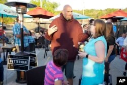 FILE - Pennsylvania Lt. Governor John Fetterman, who is running for the Democratic nomination for the U.S. Senate for Pennsylvania, greets supporters at a campaign stop in Greensburg, Pa., May 10, 2022.