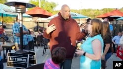Pennsylvania Lt. Governor John Fetterman greets supporters at a campaign stop, May 10, 2022, in Greensburg, Pennsylvania.