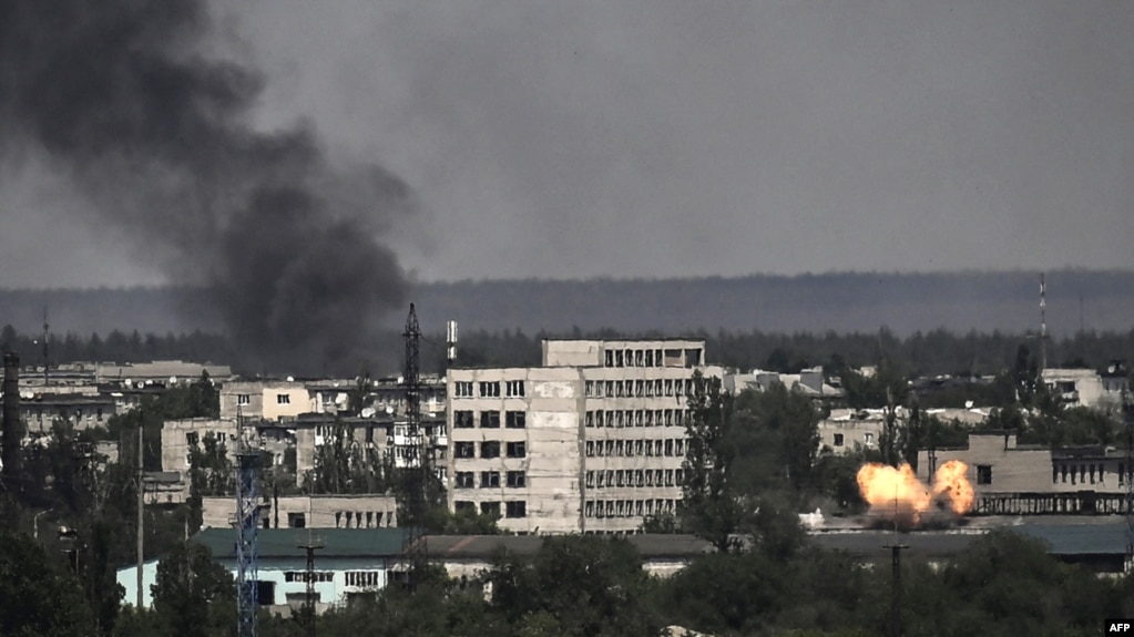 A photograph shows an explosion in the city of Sievierodonetsk during heavy fighting between Ukrainian and Russian troops in eastern Ukraine's Donbas region, May 30, 2022.