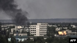 A photograph shows an explosion in the city of Sievierodonetsk during heavy fighting between Ukrainian and Russian troops in eastern Ukraine's Donbas region, May 30, 2022.