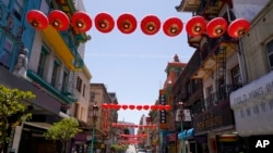 Lanterns hang in Chinatown above Grant Avenue in San Francisco, May 23, 2022.