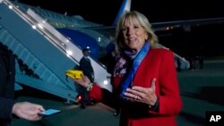 First lady Jill Biden talks to reporters before boarding a plane at Andrews Air Force Base, Md., May 5, 2022, as she heads to Romania and Slovakia.