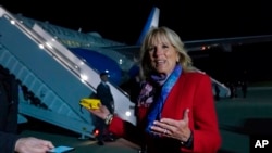 FILE - First lady Jill Biden talks to reporters before boarding a plane at Andrews Air Force Base, Md., May 5, 2022, as she heads to Romania and Slovakia.