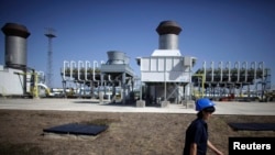 FILE - An employee walks at Bulgartransgaz gas compressor station near the town of Provadia, some 410km (255miles) north-east of Sofia, Sept. 30, 2012.