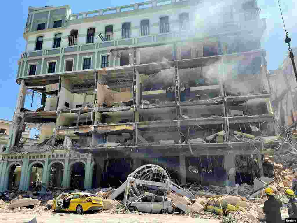 Debris is scattered after an explosion destroyed the Hotel Saratoga, in Havana, Cuba.