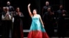 FILE - Russian operatic soprano Anna Netrebko acknowledges applause at the end of a performance at La Scala opera house in Milan, Italy, Dec. 7, 2019.