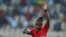 FILE - Rwandan referee Salima Mukansanga gestures during the Group B Africa Cup of Nations 2021 fixture between Zimbabwe and Guinea, Yaounde, January 18, 2022. 