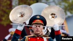Members of a Russian military band perform during a parade on Victory Day, which marks the 77th anniversary of the victory over Nazi Germany in World War Two, in Red Square in central Moscow, Russia.