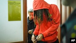 WNBA star and two-time Olympic gold medalist Brittney Griner leaves a courtroom after a hearing, in Khimki, just outside Moscow, Russia, May 13, 2022. 
