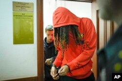 WNBA star and two-time Olympic gold medalist Brittney Griner leaves a courtroom after a hearing, in Khimki, just outside Moscow, Russia, May 13, 2022.