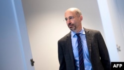 FILE - Rob Malley, President Joe Biden's top Iran negotiator, poses in his office in Washington, May 7, 2018, when Malley was CEO at the International Crisis Group.