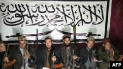 FILE - This undated handout photograph taken in an undisclosed location, released by the Tehrik-i-Taliban Pakistan (TTP) and received on Dec. 17, 2014 shows Taliban fighters who allegedly stormed an army-run school in Peshawar. (AFP photo / Tehrik-i-Talib