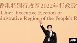 John Lee waves after becoming the city's new chief executive in Hong Kong on May 8, 2022.