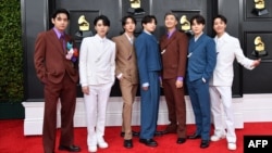 FILE - Members of the South Korean K-pop band BTS pose for a photo as they arrive for the 64th Annual Grammy Awards at the MGM Grand Garden Arena in Las Vegas, Nevada, April 03, 2022. 