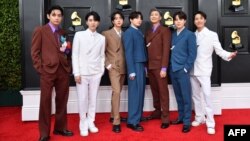 FILE - Members of the South Korean K-pop band BTS pose for a photo as they arrive for the 64th Annual Grammy Awards at the MGM Grand Garden Arena in Las Vegas, Nevada, April 03, 2022. 