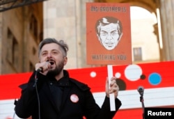 FILE - Nika Gvaramia, chief executive officer of Rustavi 2, speaks during a rally to support opposition TV channel Rustavi 2 in Tbilisi, Georgia, Feb. 19, 2017.