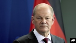 German Chancellor Olaf Scholz attends a joint press conference after a meeting with the Emir of Qatar, Sheikh Tamim bin Hamad Al Thani, at the chancellery in Berlin, Germany, Friday, May 20, 2022.