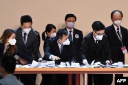 FILE - Ballots are counted for the selection process of the city's chief executive in Hong Kong, May 8, 2022.