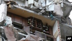 A damaged apartment building is seen in Mariupol, Ukraine, May 13, 2022.