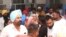 Mother, center, relatives and friends of Shubhdeep Singh Sidhu, also known around the world by his stage name Sidhu Moose Wala, arrive at a hospital after he was shot in Mansa, Punjab state, India, May 29, 2022.