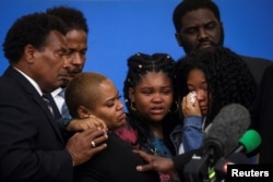 Family members of Ruth Whitfield, who was killed during a shooting at a Tops supermarket, attend a news conference with Attorney Ben Crump in Buffalo, New York, May 16, 2022.