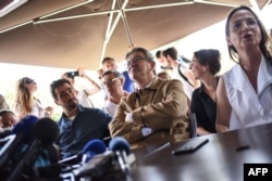 The leader of French leftist electoral coalition Nupes (Nouvelle Union populaire ecologique et sociale) Jean-Luc Melenchon (C) addresses a press conference as part of a campaign visit in Nantes, western France, May 17, 2022.