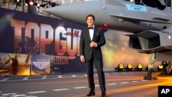 Tom Cruise poses for the media during the 'Top Gun Maverick' British premiere at a central London cinema, May 19, 2022.