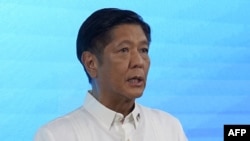 FILE - Ferdinand Marcos Jr. speaks to reporters on May 11, 2022, the same day he claimed victory in the Philippines' presidential election. His national security adviser-designate wants to stop the labeling and harassment of government critics.