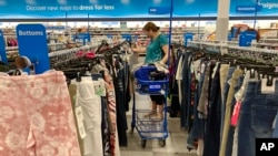 FILE - A consumer shops at a retail store in Morton Grove, Ill, July 21, 2021. The fastest inflation in 40 years squeezed retailers during the first quarter, alarming investors worried about the broader economy's outlook.