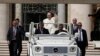 Pope Francis leaves at the end of the weekly general audience in St. Peter's Square at the Vatican, May 18, 2022. 