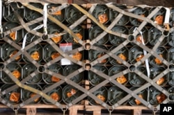 FILE - In this image provided by the U.S. Air Force, pallets of ammunition, weapons and other equipment bound for Ukraine are processed through the 436th Aerial Port Squadron during a foreign military sales mission at Dover Air Force Base, Del., Jan. 21, 2022. (Mauricio Campino/U.S. Air Force via AP)