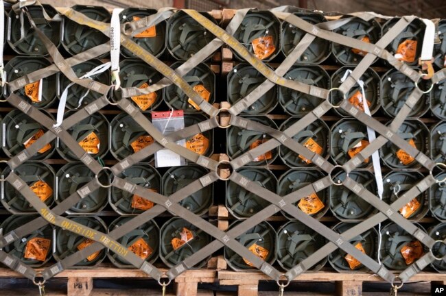 FILE - In this image provided by the U.S. Air Force, pallets of ammunition, weapons and other equipment bound for Ukraine are processed through the 436th Aerial Port Squadron during a foreign military sales mission at Dover Air Force Base, Del., Jan. 21, 2022. (Mauricio Campino/U.S. Air Force via AP)