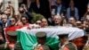 Palestinians bid farewell to Al Jazeera journalist Shireen Abu Akleh, who was killed during an Israeli raid, in Ramallah in the Israeli-occupied West Bank, May 12, 2022. 