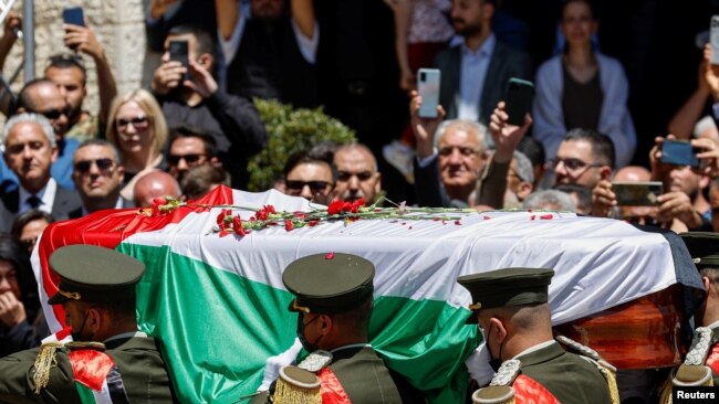 Palestinians bid farewell to Al Jazeera journalist Shireen Abu Akleh, who was killed during an Israeli raid, in Ramallah in the Israeli-occupied West Bank, May 12, 2022.