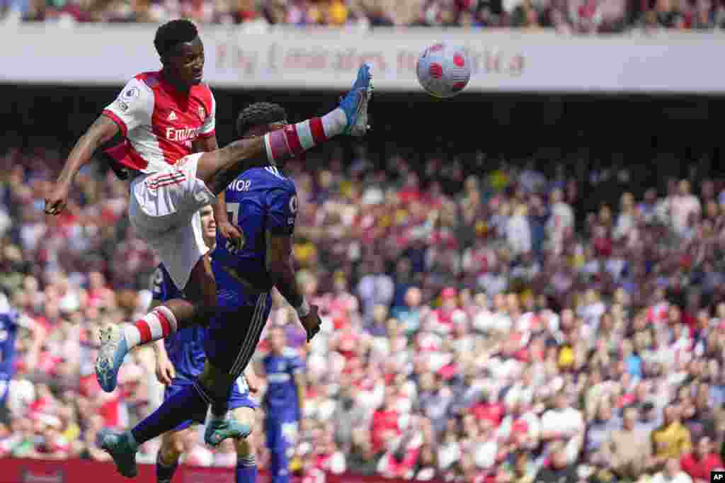 Arsenal&#39;s Eddie Nketiah, left, controls the ball during the English Premier League soccer match between Arsenal and Leeds United at the Emirates Stadium in London.