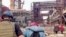 FILE - This frame taken from an undated video provided May 1, 2022, by the Azov Special Forces Regiment of the Ukrainian National Guard shows people walking over debris at the Azovstal steel plant, in Mariupol, eastern Ukraine. 